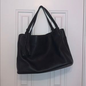 Black medium leather tote bag with tassel